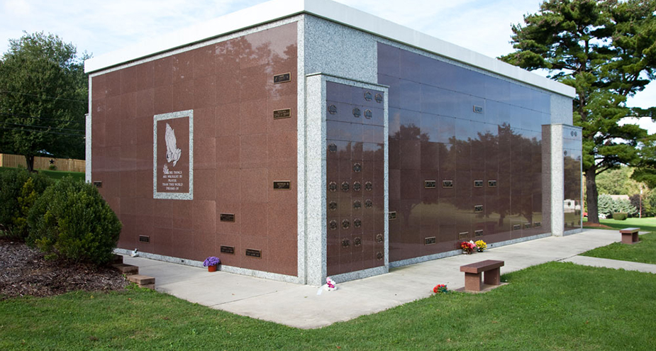 Garden mausoleum surrounded by landscaped gardens and flowers